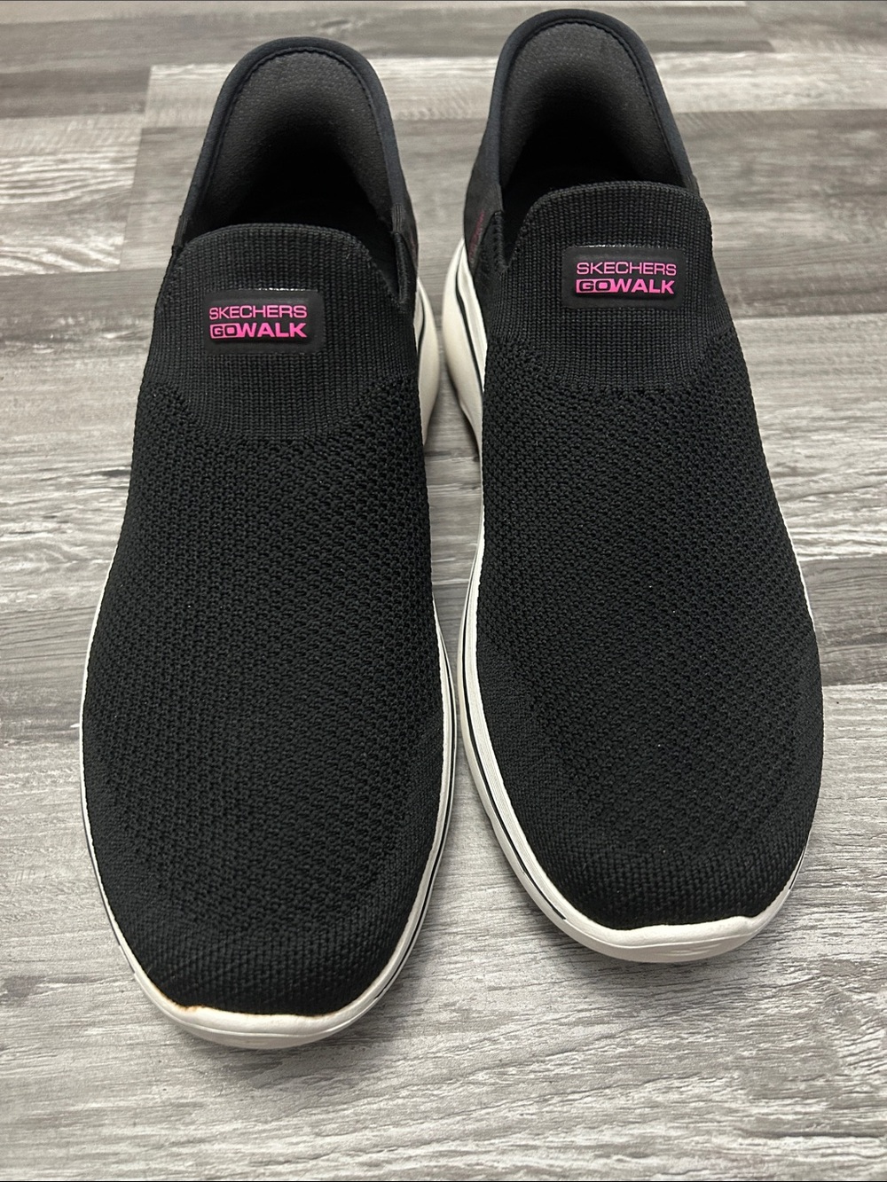 Skechers GOwalk Slip-On Knit Sneakers in Black with Pink Logo